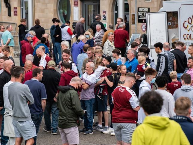 Cobblers fan outside the PTS Academy Stadium on Saturday (August 7). Photo: Louise Smith
