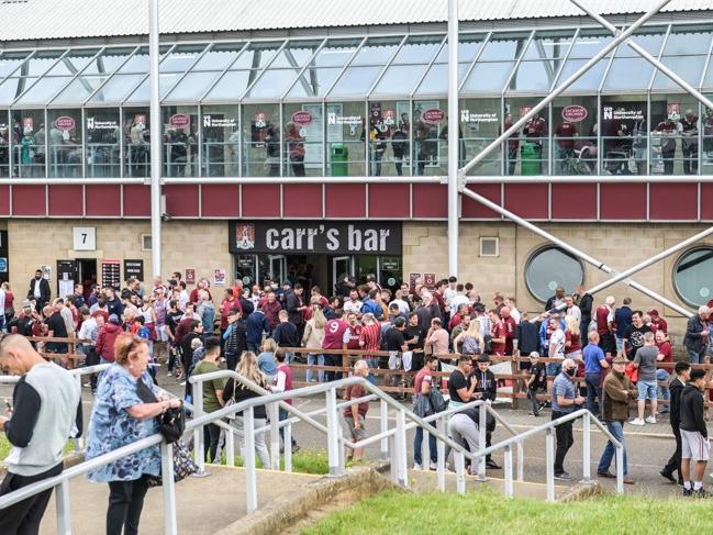 Cobblers fan outside the PTS Academy Stadium on Saturday (August 7). Photo: Louise Smith