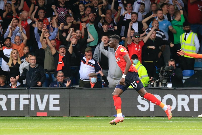 Elijah Adebayo scores Town's first goal of the Championship season.