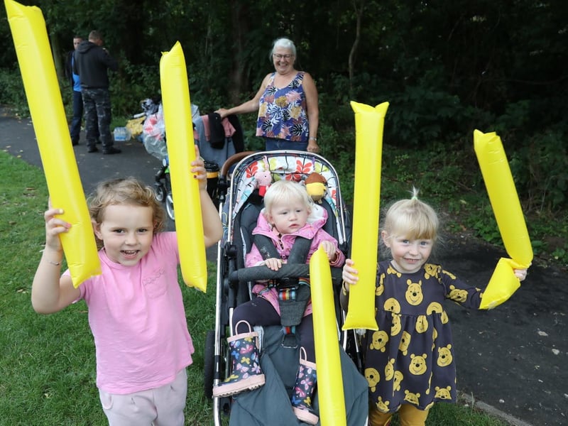 Cousins Bonnie Smith, 4, Freya Welch, 1, and Thea Welch, 3, cheer on their mums