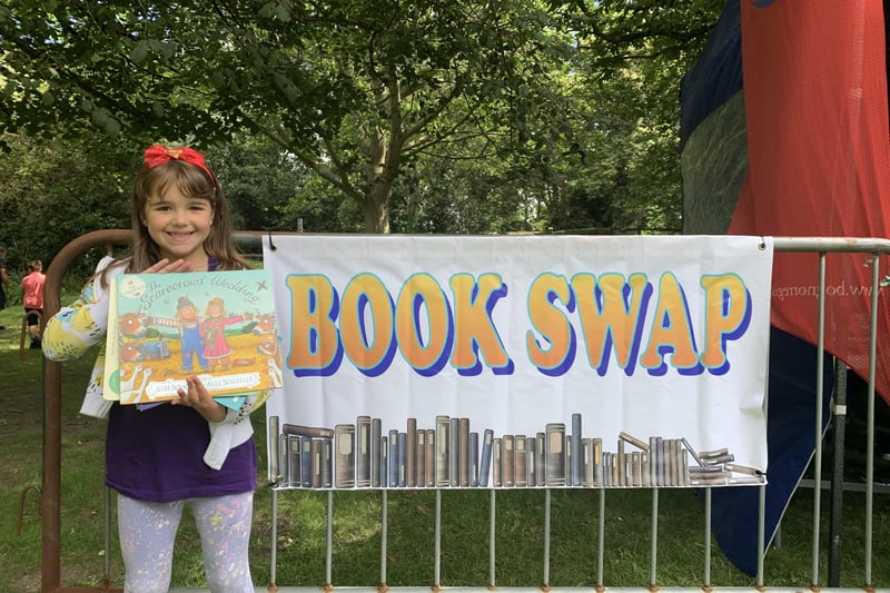 Lyla with a book she swapped at the event