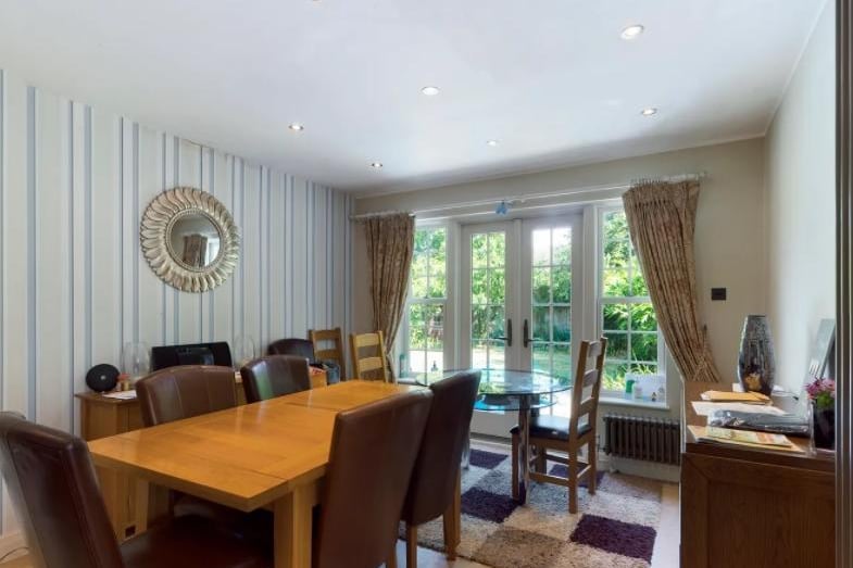 The dining room offers plenty of space for guests as well as clean space for family meals.