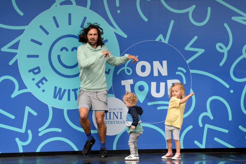 Joe Wicks on stage with his children Indie and Marley. (Photo by Eamonn M. McCormack/Getty Images) SUS-211008-082216001