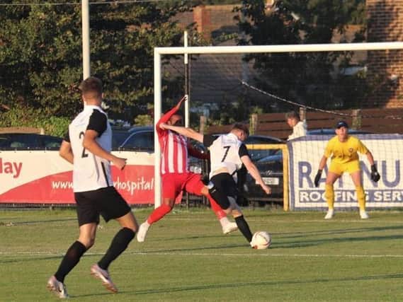 Action from the FA Cup extra preliminary round replay at Pagham, which Steyning won 3-2 / Picture: Roger Smith