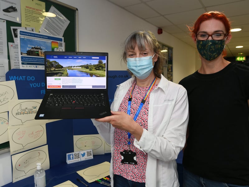 Millfield Festival.    Susan Davidson and Trish Barker-Barrett from How Are You Peterborough looking at the NHS Wellbeing website at Gladstone Community Centre. EMN-210808-164127009