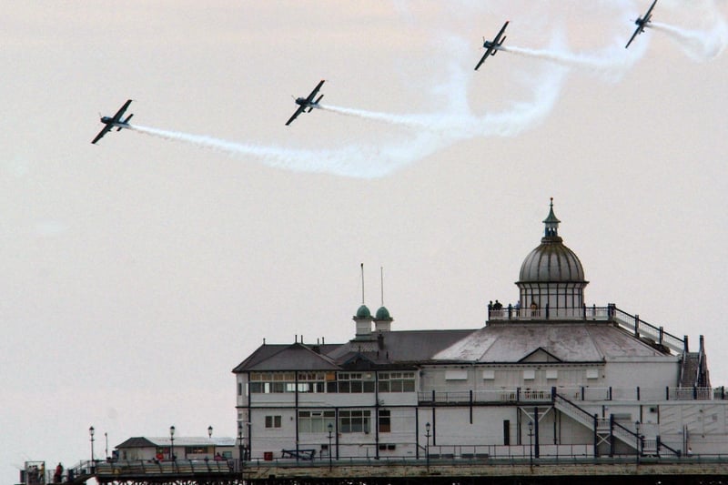 THE BLADES FLY NEAR THE PIER