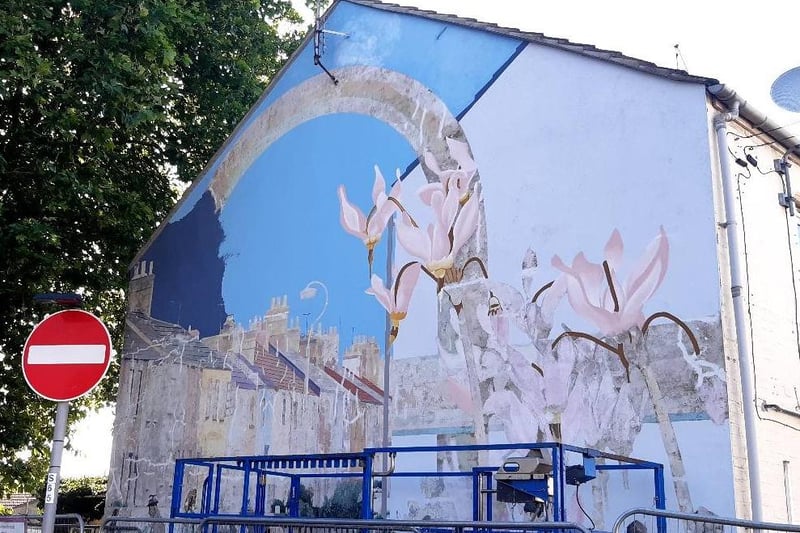 The on-going  work taking place to restore the Link Road Mural in Peterborough