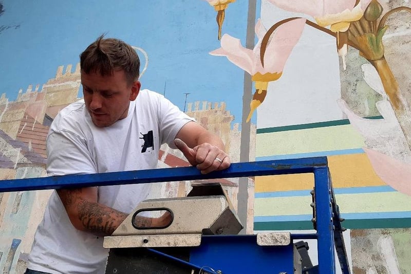 The on-going  work taking place to restore the Link Road Mural in Peterborough