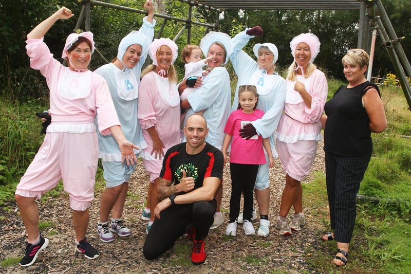 Ladies doing an assault course dressed as babies to raise money for Southampton neonatal unit. With the owner or Rookery Fit Farm Dean Whitfield, and one of the organisers Fiona Edwards. Photo by Derek Martin Photography.