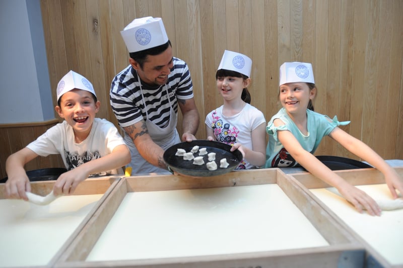 Chef Jerusalem Fernandez making dough balls with Jack Bryant, Skye Dummer and Sophie Bryant during pizza making at MADhurst 2011. Picture: Louise Adams

C111347-1