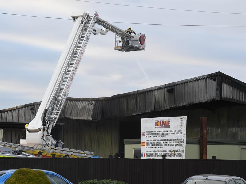 Firefighters continue to dampen down the building.