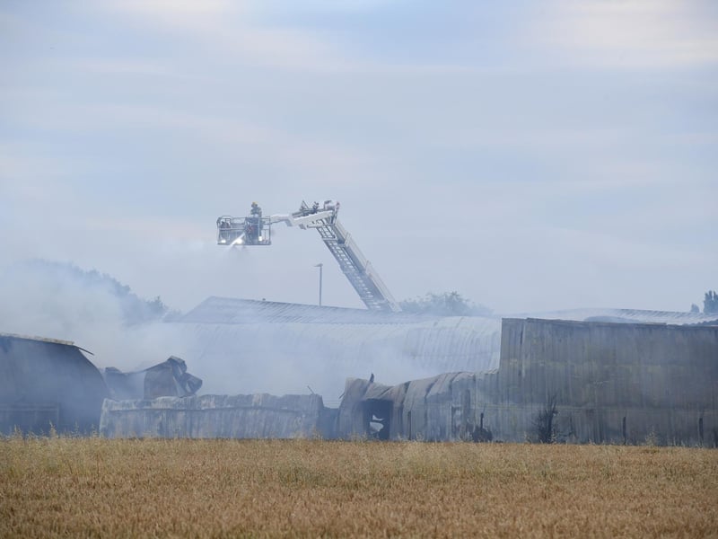 The building was still smoking at teatime.