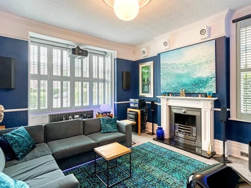 The media room is fitted with electronically operated black out blinds, a retractable cinema screen and wiring in place for surround sound. Picture: Savills - Haywards Heath.