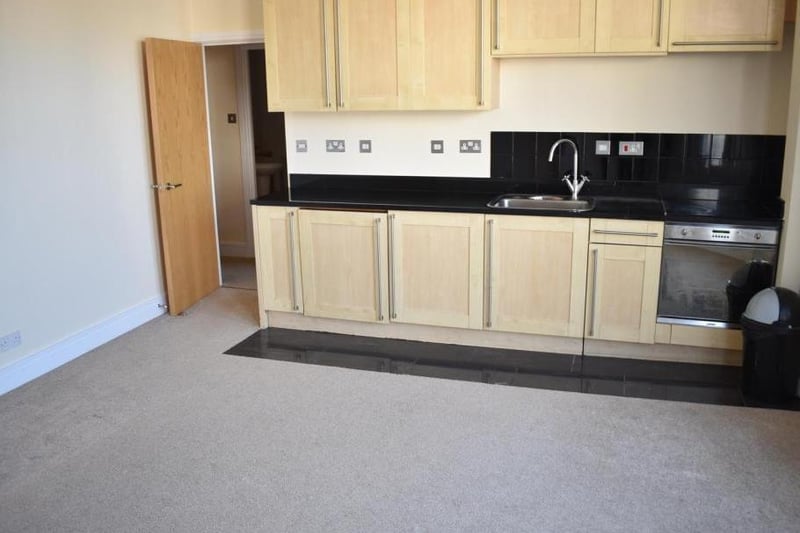 This flat on the market for £90,000 has an open plan living room/kitchen with appliances, a double bedroom with built-in wardrobes and a bathroom with a shower over the bath, all in a central location. 
Listed by: Chelton Brown