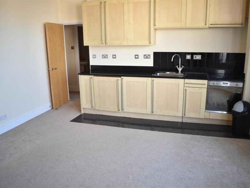 This flat on the market for £90,000 has an open plan living room/kitchen with appliances, a double bedroom with built-in wardrobes and a bathroom with a shower over the bath, all in a central location.
Listed by: Chelton Brown