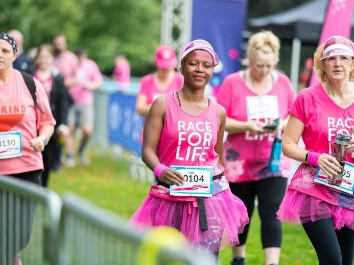 Hundreds ran, jogged and walked around Abington Park on Saturday (August 21) to raise money for Cancer Research UK. Photo: Kirsty Edmonds.