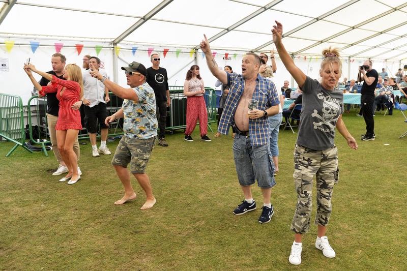 Revellers dancing in the entertainment tent