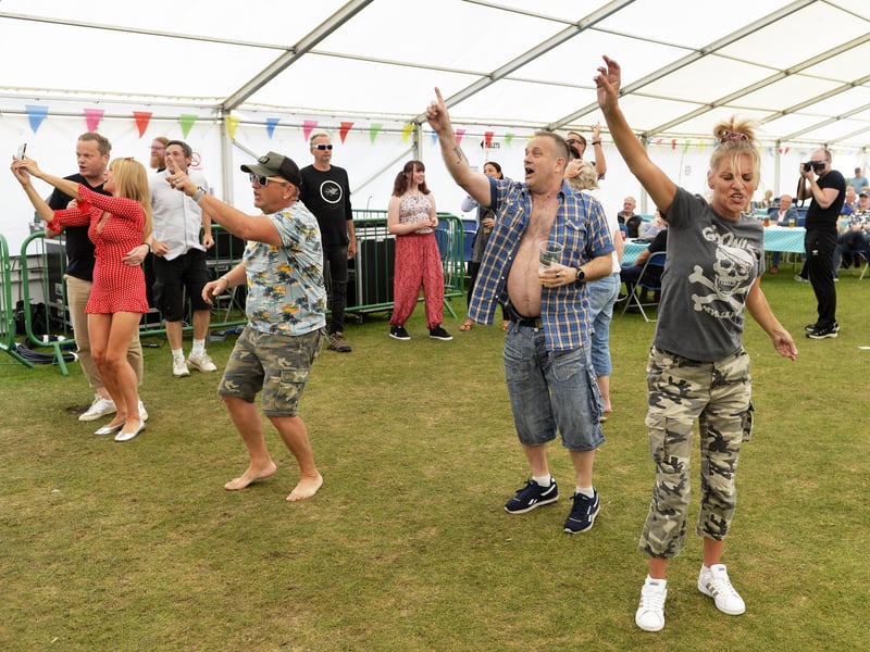 Revellers dancing in the entertainment tent