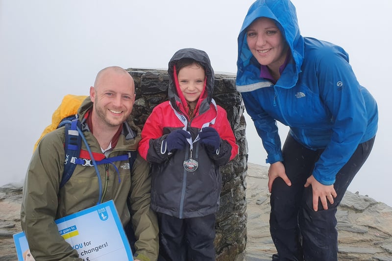 Paige, her dad Mark, and her mum Samantha, reached the top of the mountain despite the weather not being on their side