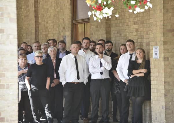 Mourners gather at Peterborough Crematorium.