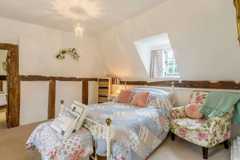 The first floor comprises two interconnecting bedrooms, which both enjoy views over the rear garden. Picture: Strutt & Parker - Horsham.
