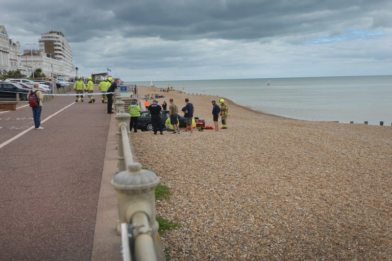 A car has ended up on the beach after crashing through the railings at Marina Car Park, St Leonards. SUS-210826-150955001