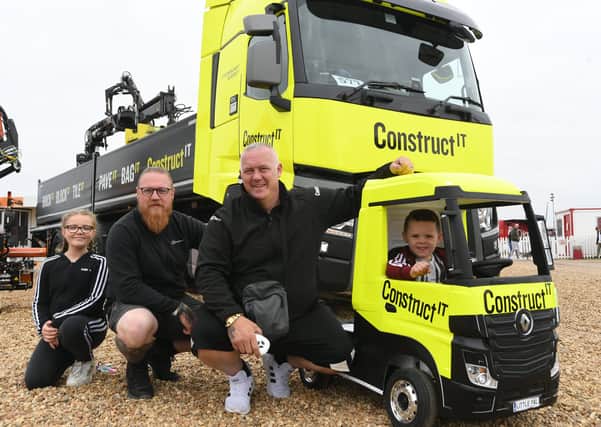 Truckfest 2021 at the East of England Arena.  Jasmine Carter, David Britain, James Carter and Tommy Carter with the Construct IT trucks EMN-210829-170319009