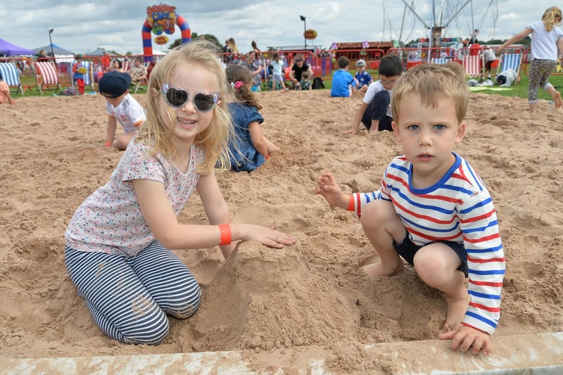 Summer Moyers, 5, and Benny Moyers, 4, enjoying the Beach Festival at the Harborough Showground during the bank holiday.