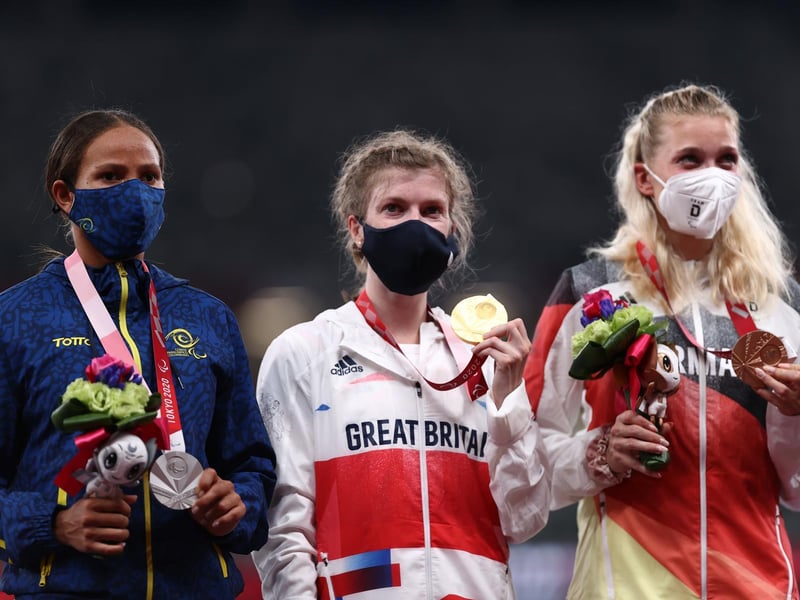 Silver medalist Darian Faisury Jimenez Sanchez of Team Colombia, gold medalist Sophie Hahn of Team Great Britain and bronze medalist Lindy Ave of Team Germany celebrate during the medal ceremony for the Women’s 100m - T38 Final on day 4 of the Tokyo 2020 Paralympic Games at Olympic Stadium on August 28, 2021 in Tokyo, Japan. (Photo by Dean Mouhtaropoulos/Getty Images)