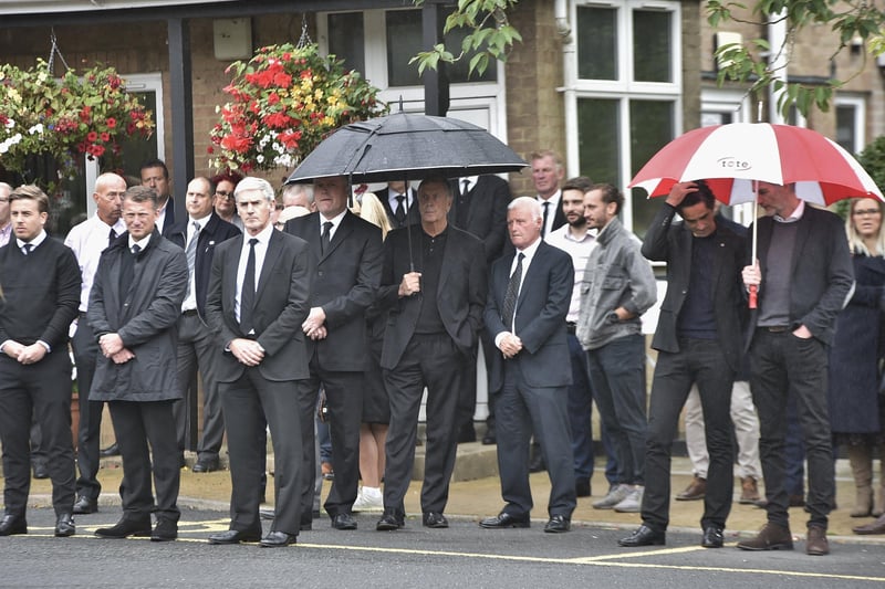 Mourners gather at the funeral of Robbie Cooke at the Crematorium.