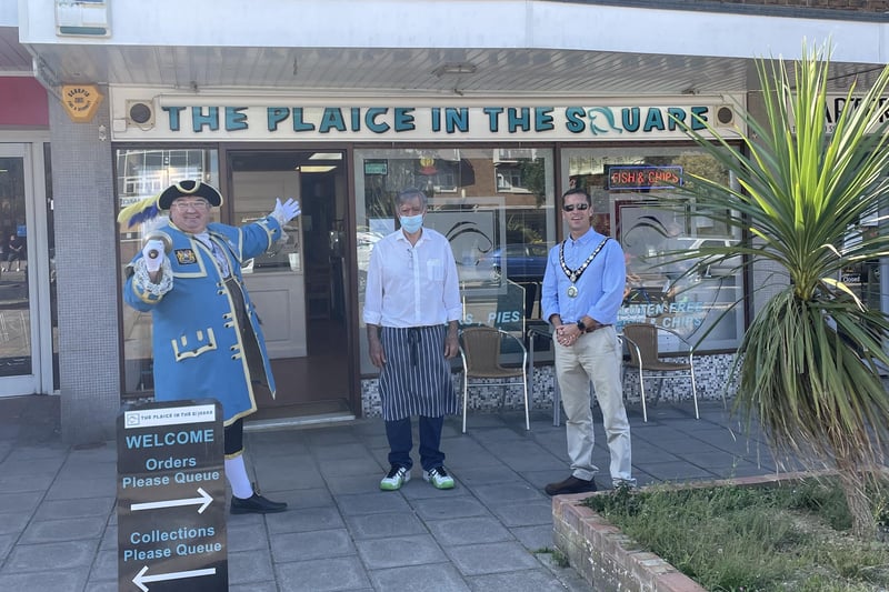 Chairman of Adur District Council, Stephen Chipp, and  Worthing town crier, Bob Smytherman, outside restaurant The Plaice in the Square, Southwick