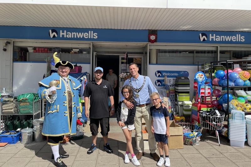 Stephen Chipp, chairman of Adur District Council outside Hanwells in Southwick with his children and Worthing town crier, Bob Smytherman