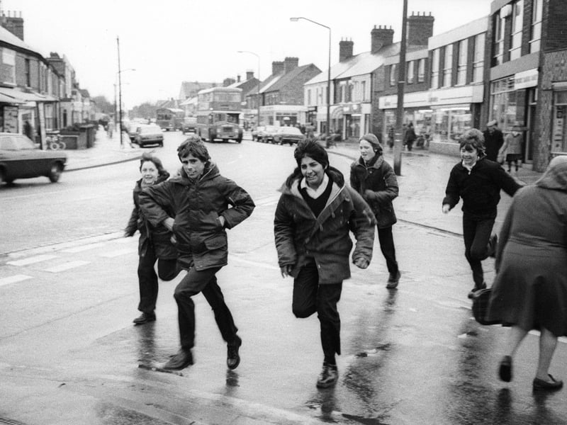 Youngsters running to beat the rain by Chris Porsz.
