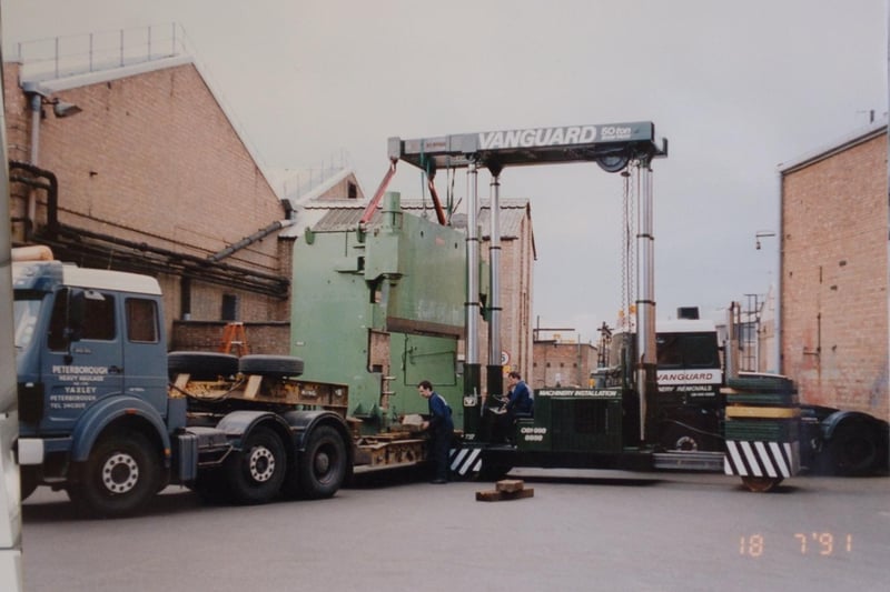 A huge load leaves the factory. Some have suggesetd this was a large oven. Do you know what is being loaded here?