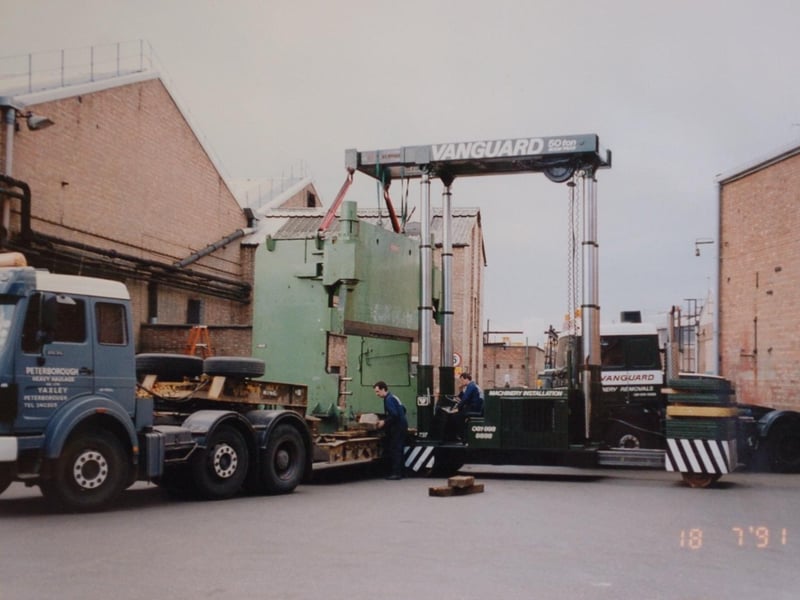 A huge load leaves the factory. Some have suggesetd this was a large oven. Do you know what is being loaded here?