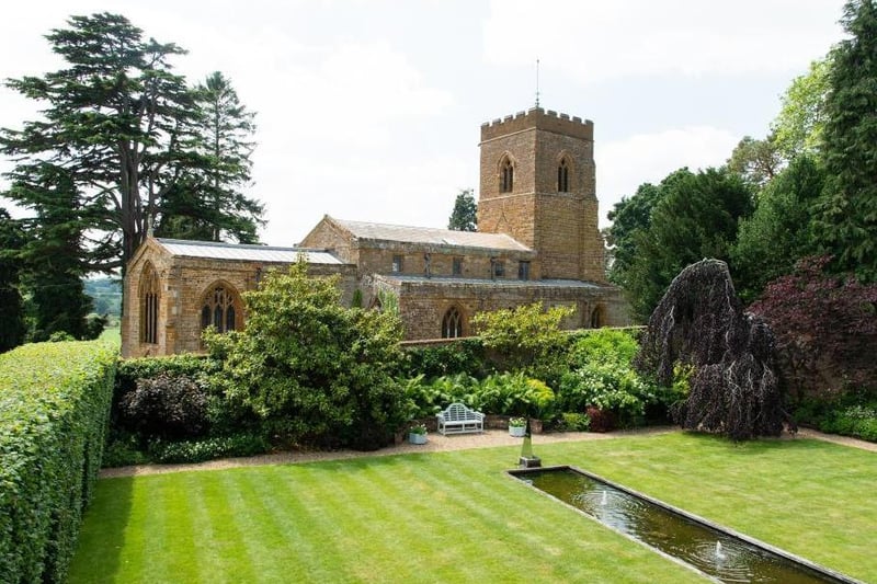 This traditional style home has stunning gardens and overlooks the village church. On the market for 1.5 million.