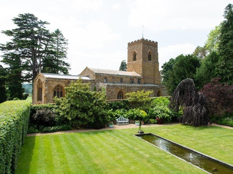 This traditional style home has stunning gardens and overlooks the village church. On the market for 1.5 million.