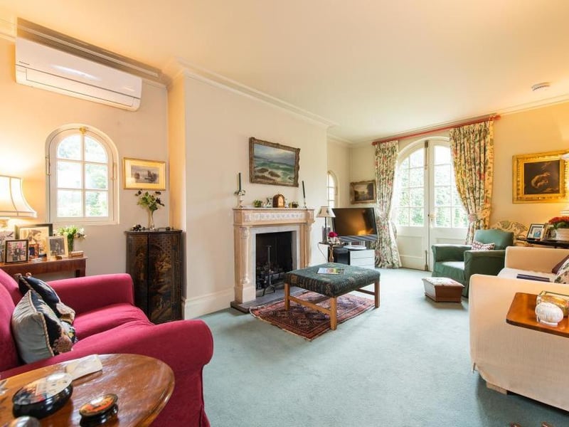 This traditional style home has stunning gardens and overlooks the village church. On the market for 1.5 million.
