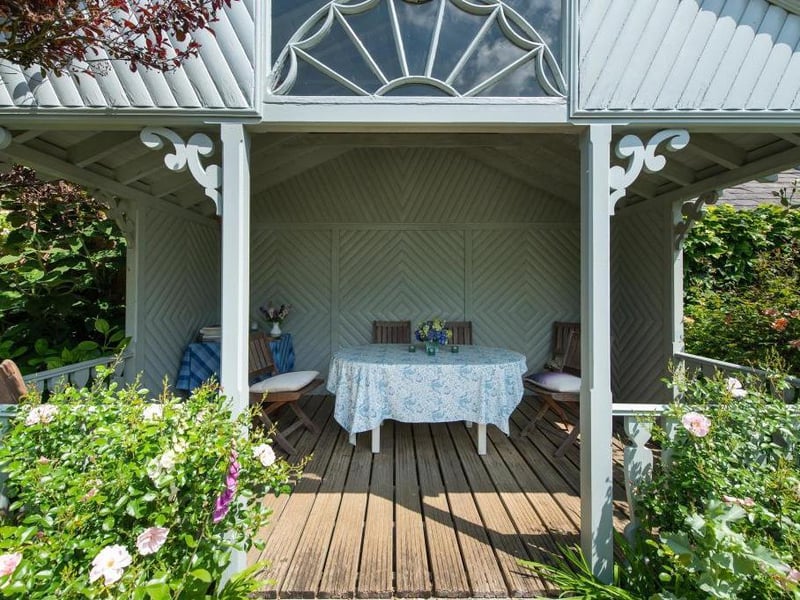This traditional style home has stunning gardens and overlooks the village church. On the market for 1.5 million.