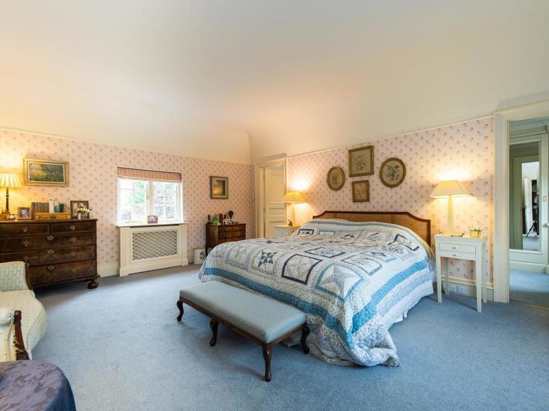 This traditional style home has stunning gardens and overlooks the village church. On the market for 1.5 million.