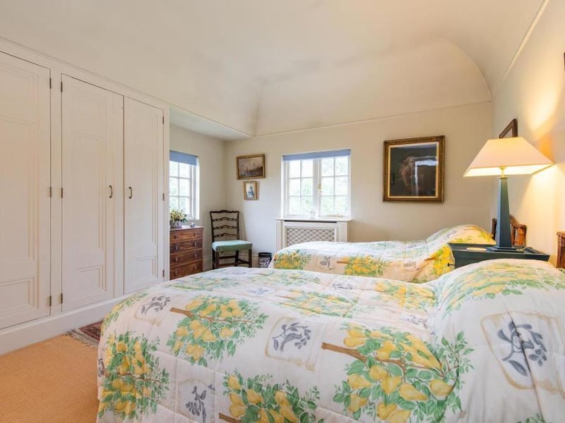 This traditional style home has stunning gardens and overlooks the village church. On the market for 1.5 million.
