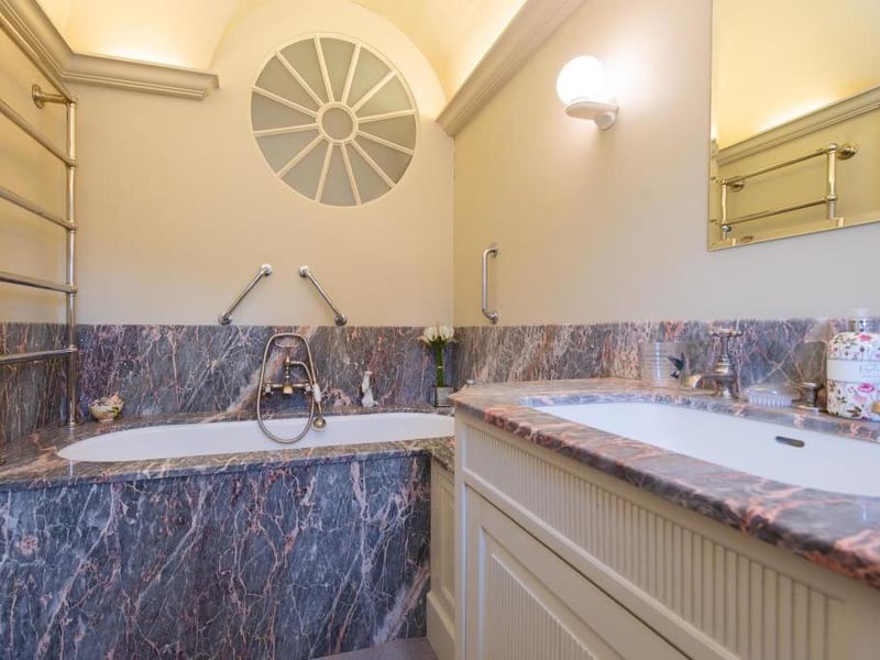This traditional style home has stunning gardens and overlooks the village church. On the market for 1.5 million.