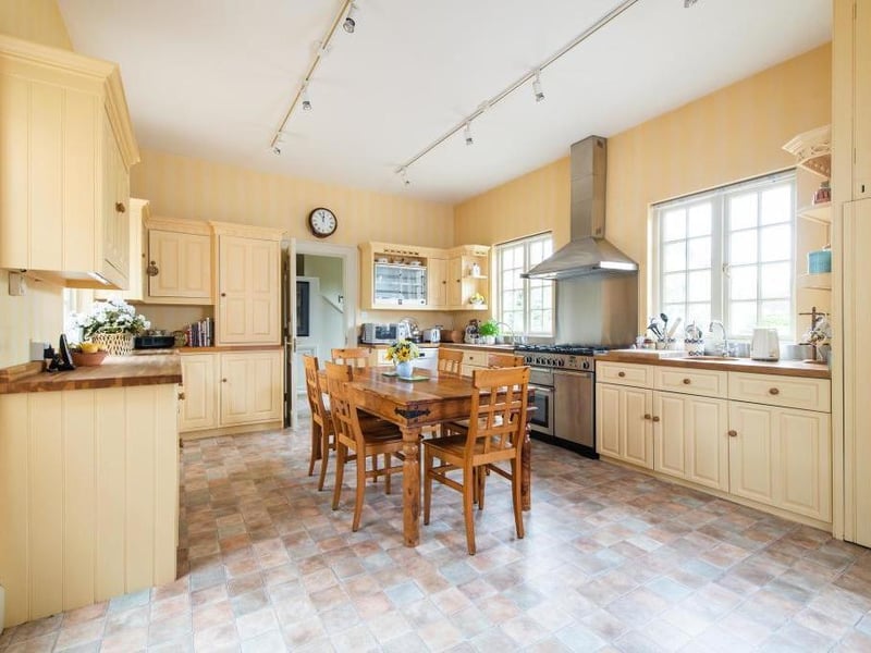 This traditional style home has stunning gardens and overlooks the village church. On the market for 1.5 million.