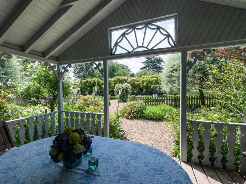 This traditional style home has stunning gardens and overlooks the village church. On the market for 1.5 million.