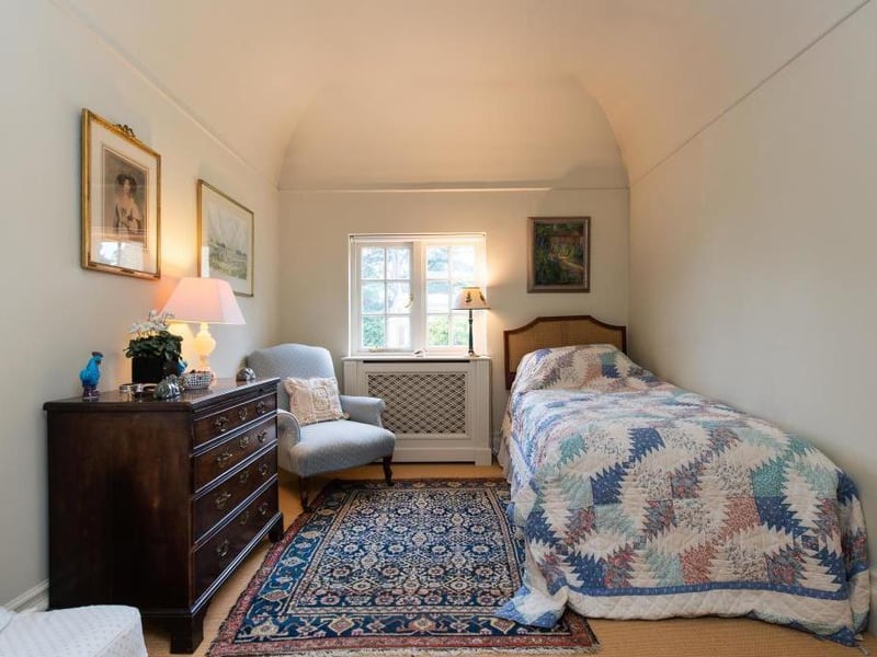 This traditional style home has stunning gardens and overlooks the village church. On the market for 1.5 million.