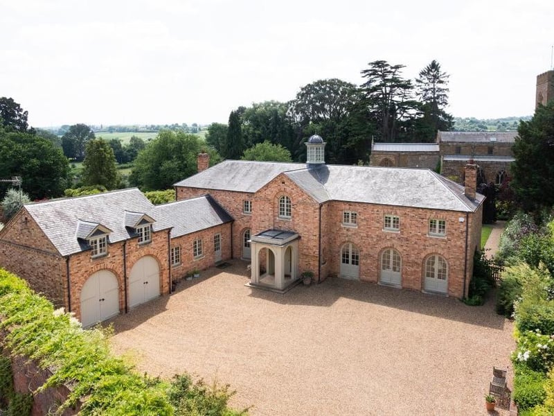 This traditional style home has stunning gardens and overlooks the village church. On the market for 1.5 million.