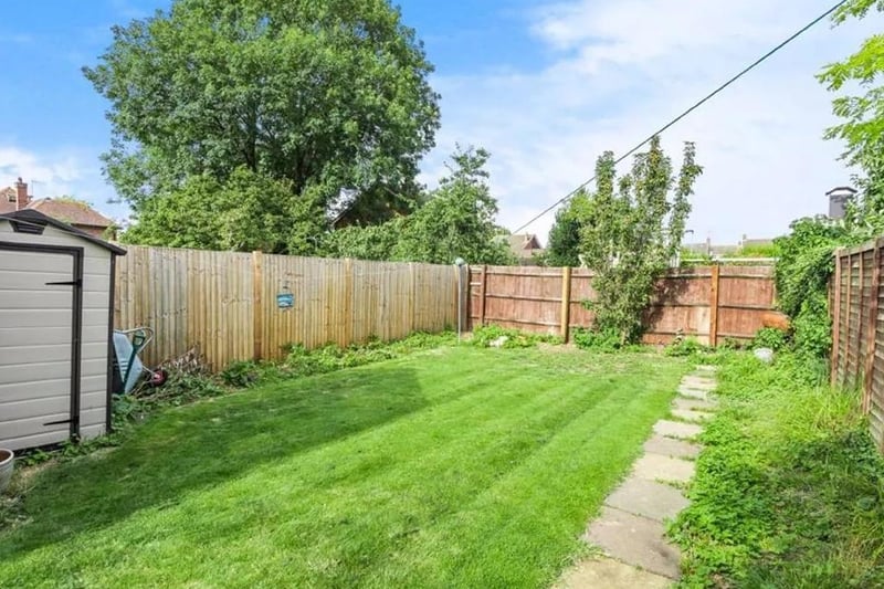 Outside, there is a lawned garden which enjoys some privacy from neighbouring properties