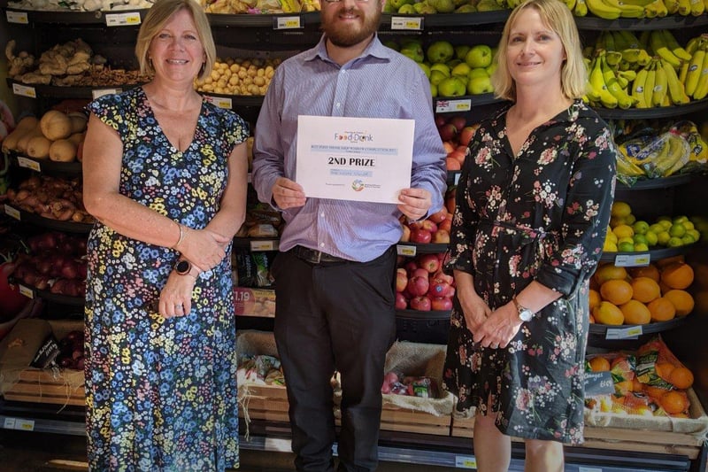 James from Sussex Grocer, receiving his prize from Lynda & Rebecca. Photo: Annie Meacham Steyning Camera Club