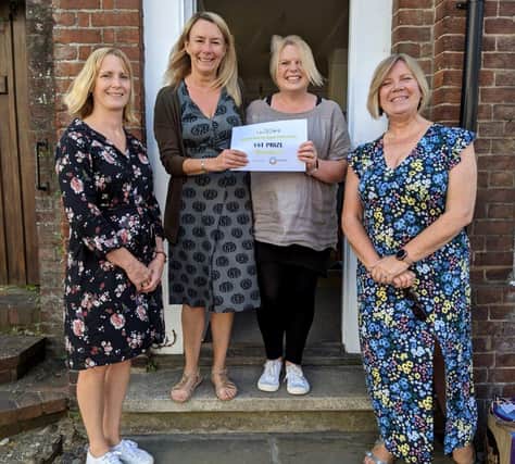 St Barnabas receiving their cheque & certificate from Lynda Spain (on the left) and Shop Window Competition sponsors, Rebecca from the Steyning Business Chamber. Photo: Annie Meacham Steyning Camera Club