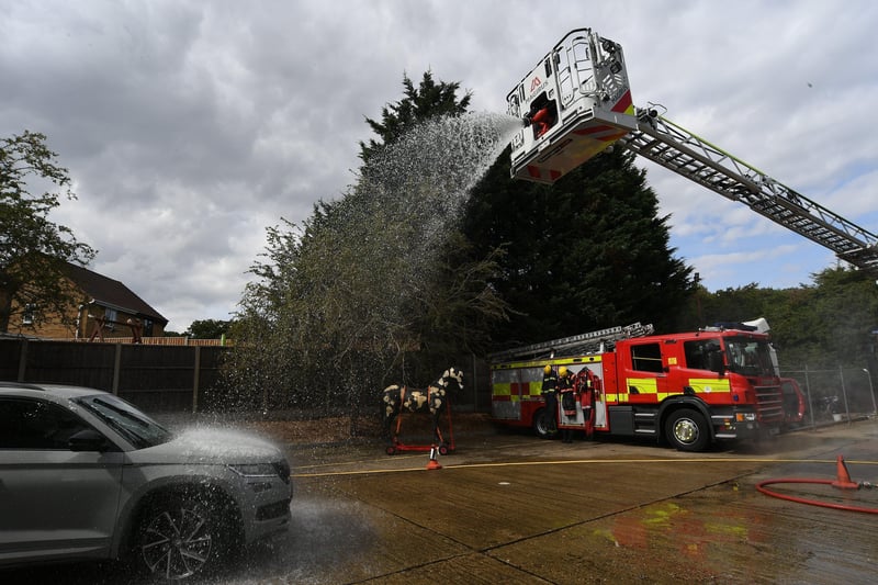 Stanground fire fighters and volunteers at their annual car wash at the Fire Station. EMN-211209-160803009